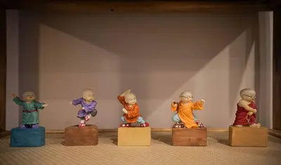 a group of figurines sitting on boxes on a shelf at 204 - Modern Cozy Suite with 2BR, Gym, Parking, DT & Airport in Montréal