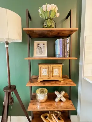 a book shelf with a vase of flowers and a lamp at 205 - Cozy Green Oasis 1987 Collection with 2BR,Parking,DT in Montréal