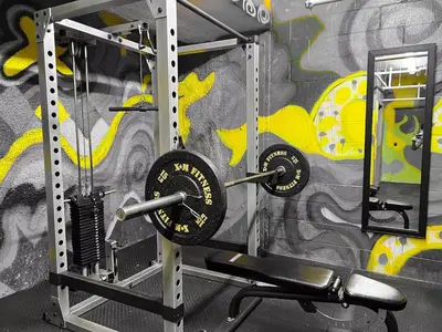 a gym with dumbbells and a wall with graffiti at 205 - Cozy Green Oasis 1987 Collection with 2BR,Parking,DT in Montréal