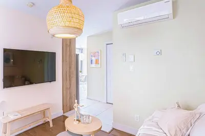 a living room with a couch and a table at 112 - Spacious 1BR Getaway, Gym, Paid Parking in Montréal