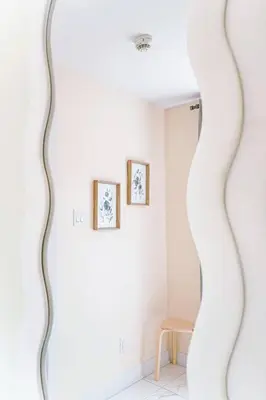 a mirror in a room with a table and a chair at 112 - Spacious 1BR Getaway, Gym, Paid Parking in Montréal