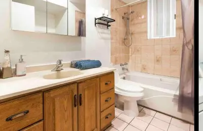 a bathroom with a sink and a toilet and a tub at FULL KITCHEN 6min from DTOWN Room B in Montréal