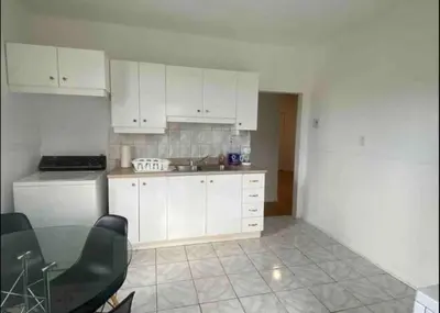 a kitchen with white cabinets and a glass table at FULL KITCHEN 6min from DTOWN Room B in Montréal