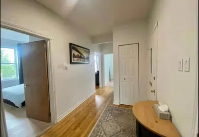 a room with a door and a bed and a table at FULL KITCHEN 6min from DTOWN Room B in Montréal