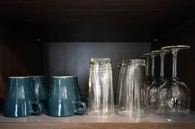 a group of glass vases sitting on a shelf at 201 - Comfy Spacious 2BR Apt with Gym, Parking, DT&Airport in Montréal