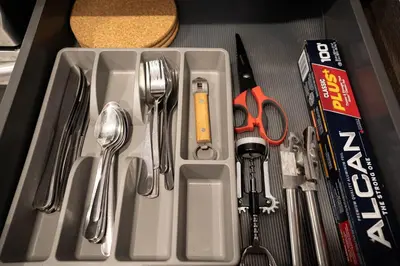 a drawer filled with utensils and a box with a drawer at 202 - Modern Exquisite Suite with Gym,Parking, near DT&Airport in Montréal