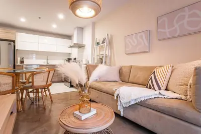 a living room with a couch and a table at 203 - Fantastic Cozy New 2 Queen Condo with Gym, DT&Airport in Montréal