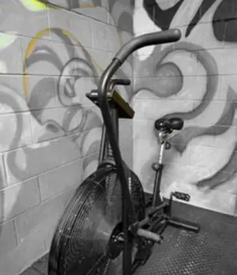 a bike with a purse hanging on a wall at 203 - Fantastic Cozy New 2 Queen Condo with Gym, DT&Airport in Montréal