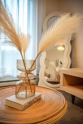 a table with a book and a feather in a room at 203 - Fantastic Cozy New 2 Queen Condo with Gym, DT&Airport in Montréal