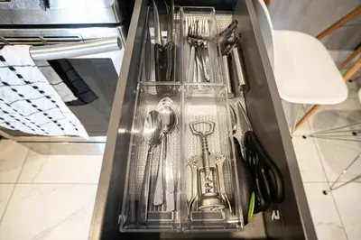 a drawer filled with utensils in a refrigerator at 207 - Mondern Cozy New Apt with 2BR, Prking, Gym,DT&Airport in Montréal