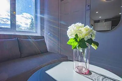 a vase with white flowers sitting on a table at 208 - Modern Cozy Bright Apt with 2BR,Gym,Prking,DT&Airport in Montréal