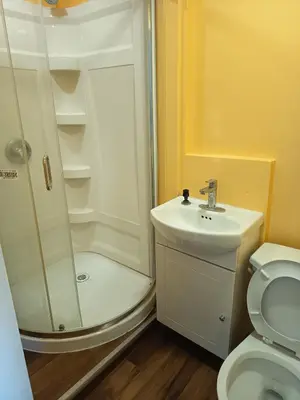 a bathroom with a shower and a sink and a toilet at Iphigenie in Montréal