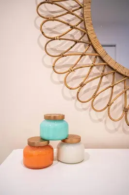 three different colored jars sitting next to a sculpture at 210 - Fantastic Neat 2BR with Parking, Gym, near DT&Airport in Montréal