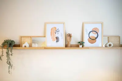a shelf with three pictures on top of it at 210 - Fantastic Neat 2BR with Parking, Gym, near DT&Airport in Montréal