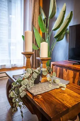 a table with two candles on top of it at 211 - Cozy New Condo with 2 Queens, Parking, DT&Airport in Montréal