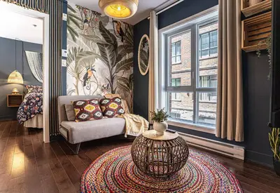a living room with a couch and a table at 214 - Boho Ambiance Designer 2BR with Gym,Prking,DT&Airport in Montréal