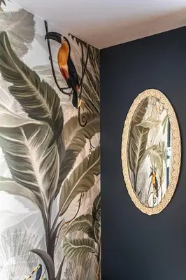 a mirror on a wall with a painting of a bird at 214 - Boho Ambiance Designer 2BR with Gym,Prking,DT&Airport in Montréal