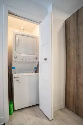 a kitchen with a white refrigerator and a microwave at 214 - Boho Ambiance Designer 2BR with Gym,Prking,DT&Airport in Montréal