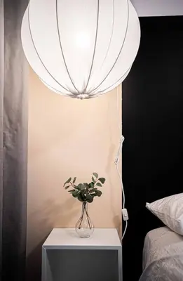 a vase with a plant on a table with a lamp at 217 - Pastel Stylist 2 KING-BR with Parking, nr DT&Airport in Montréal