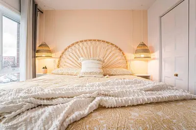 a bedroom with a large bed with a large window at 217 - Pastel Stylist 2 KING-BR with Parking, nr DT&Airport in Montréal