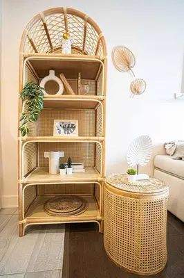 a wicker shelf in a living room with a table at 217 - Pastel Stylist 2 KING-BR with Parking, nr DT&Airport in Montréal