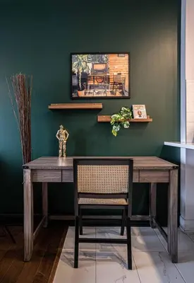 a dining room with a wooden table and a chair at 218 - Emerald Retro KING Suite with Parking, Gym,DT&Airport in Montréal