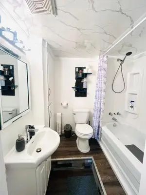 a bathroom with a toilet and a sink and a tub at Linda inn - Entire Unit- Sleep 3- Sherbrooke in Sherbrooke
