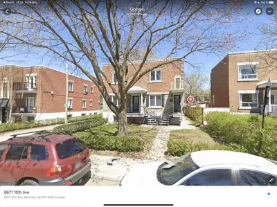 two cars parked in a parking lot in front of a house at Fully equiped flat, great location - ideal for relocation or short term mission in Montréal