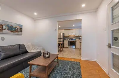 a living room with a couch and a table at Fully equiped flat, great location - ideal for relocation or short term mission in Montréal