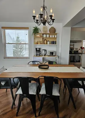 a dining room with a table and chairs at Condo ÉVASION in Magog-Orford