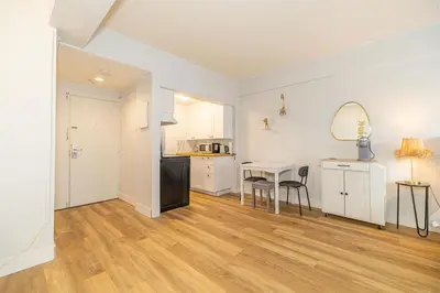a kitchen and dining room with a table and chairs at Studio in heart of DT,walk to 2 metros,Concordia in Montréal