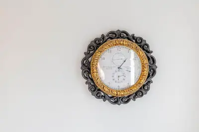 a gold and black clock hanging on a wall at 1 BDR at heart of DT, walk to 2 metros, Concordia in Montréal