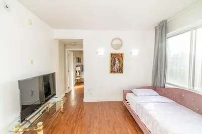 a living room with a couch and a flat screen tv at 1 BDR at heart of DT, walk to 2 metros, Concordia in Montréal