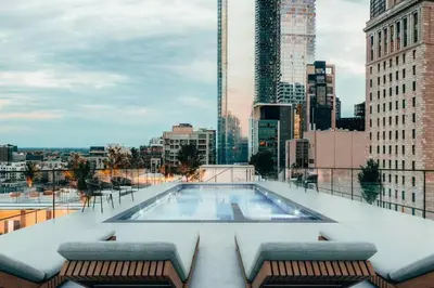 a swimming pool on top of a building at Old Montreal Suite with Rooftop Pool & Terrace in Montréal