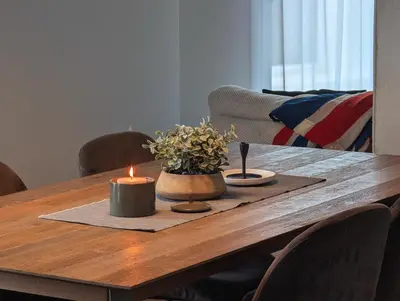 a wooden table with two candles on top of it at Old Montreal Suite with Rooftop Pool & Terrace in Montréal