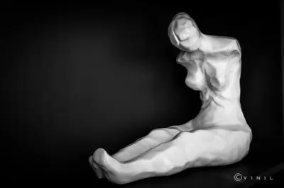a white statue of a man sitting with his legs crossed at Villa Nao in Roxton Falls