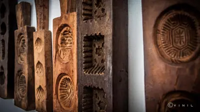a bunch of wooden doors with designs on them at Villa Nao in Roxton Falls