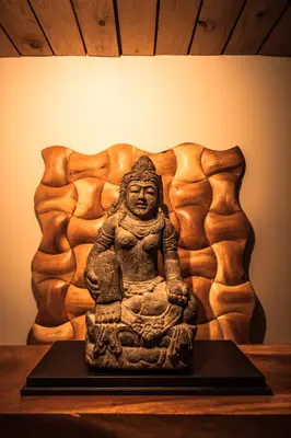 a statue of a woman sitting on a table at Villa Nao in Roxton Falls