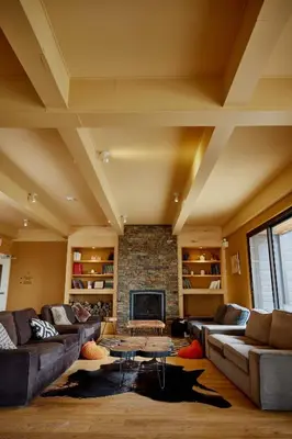 a large living room with couches and a fireplace at Hotel de l'Horizon in Sutton