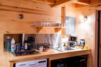 a kitchen with a sink and a counter top at Hotel de l'Horizon in Sutton