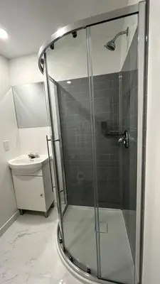 a glass shower in a bathroom with a sink at St-denis II-3 Apt In the heart of Montreal in Montréal