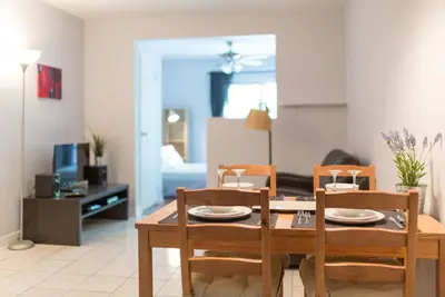 a living room with a dining room table and chairs at St-denis II-3 Apt In the heart of Montreal in Montréal