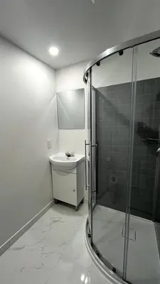 a bathroom with a glass shower and a sink at St-denis II-3 Apt In the heart of Montreal in Montréal