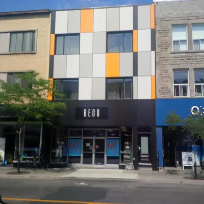 a building with an orange white and blue at Le Mont-Royal Lounge by HomeInMontreal in Montréal