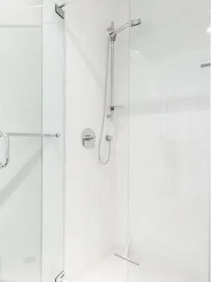 a shower with a glass door in a bathroom at Le Mont-Royal Lounge by HomeInMontreal in Montréal