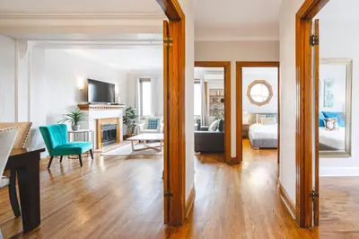 a living room with a large mirror and a living room at MTLVacationrentals-The MTLVR Kisses in Montréal