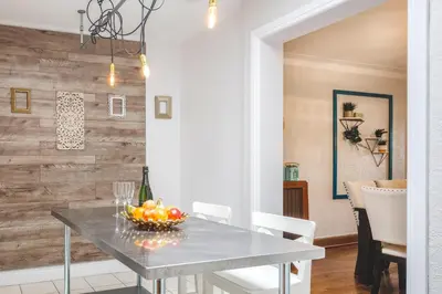 a dining room with a table with a bowl of fruit at MTLVacationrentals-The MTLVR Kisses in Montréal