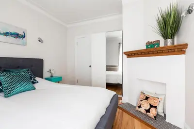 a bedroom with a bed and a fireplace at MTLVacationrentals-The MTLVR Kisses in Montréal