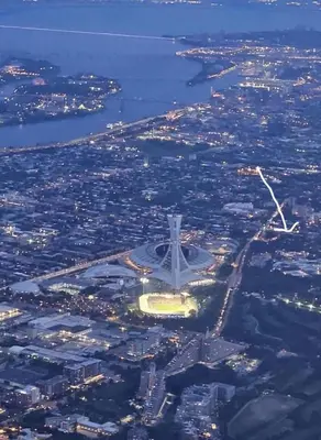 an aerial view of an airport and a city at L'Adresse Botanique - Studio in Montréal