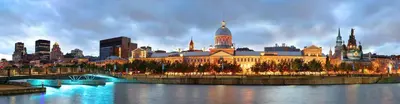 a large building with a city in the background at L'Adresse Botanique - Studio in Montréal